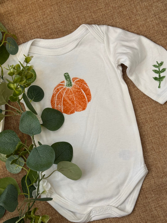 Pumpkin hand printed baby grow