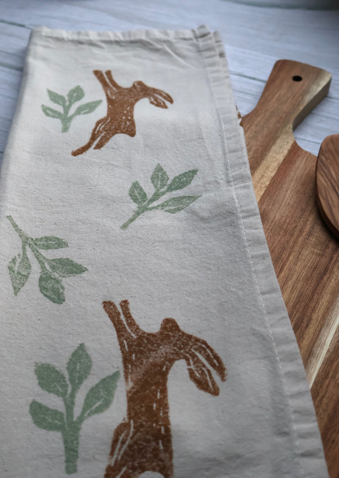 Autumn Jumping Hares Tea Towel