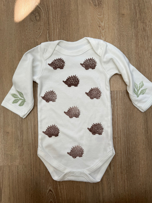 Woodland hedgehogs & leaves block printed baby grow. Long sleeve